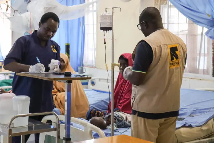 Mother and children receiving healthcare support in Nigeria